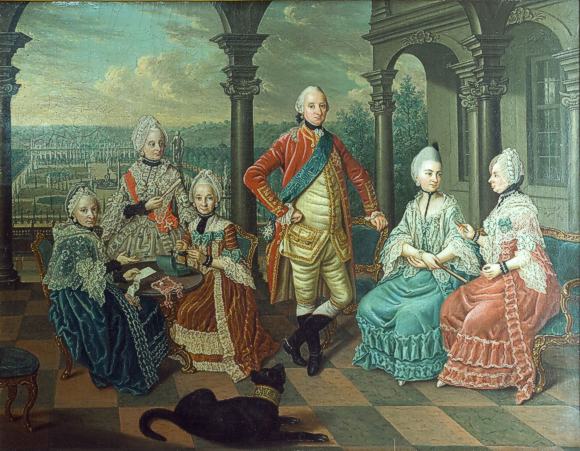 Ludwig Friedrich Carl F&uuml;rst zu Hohenlohe-Neuenstein-&Ouml;hringen (23.5.1723 - 27.7.1805) und seine Familie auf der Terrasse von Schloss Weikersheim mit dem Schlossgarten und der Orangerie im Hintergrund. Deutlich sichtbar: die Zypressen.